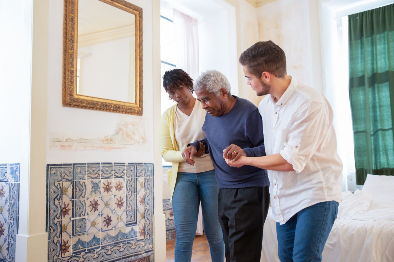 The Art of Drawing Readers In: Your attractive post title goes here Elderly man receiving assistance in a beautiful room with traditional Portuguese tiles.